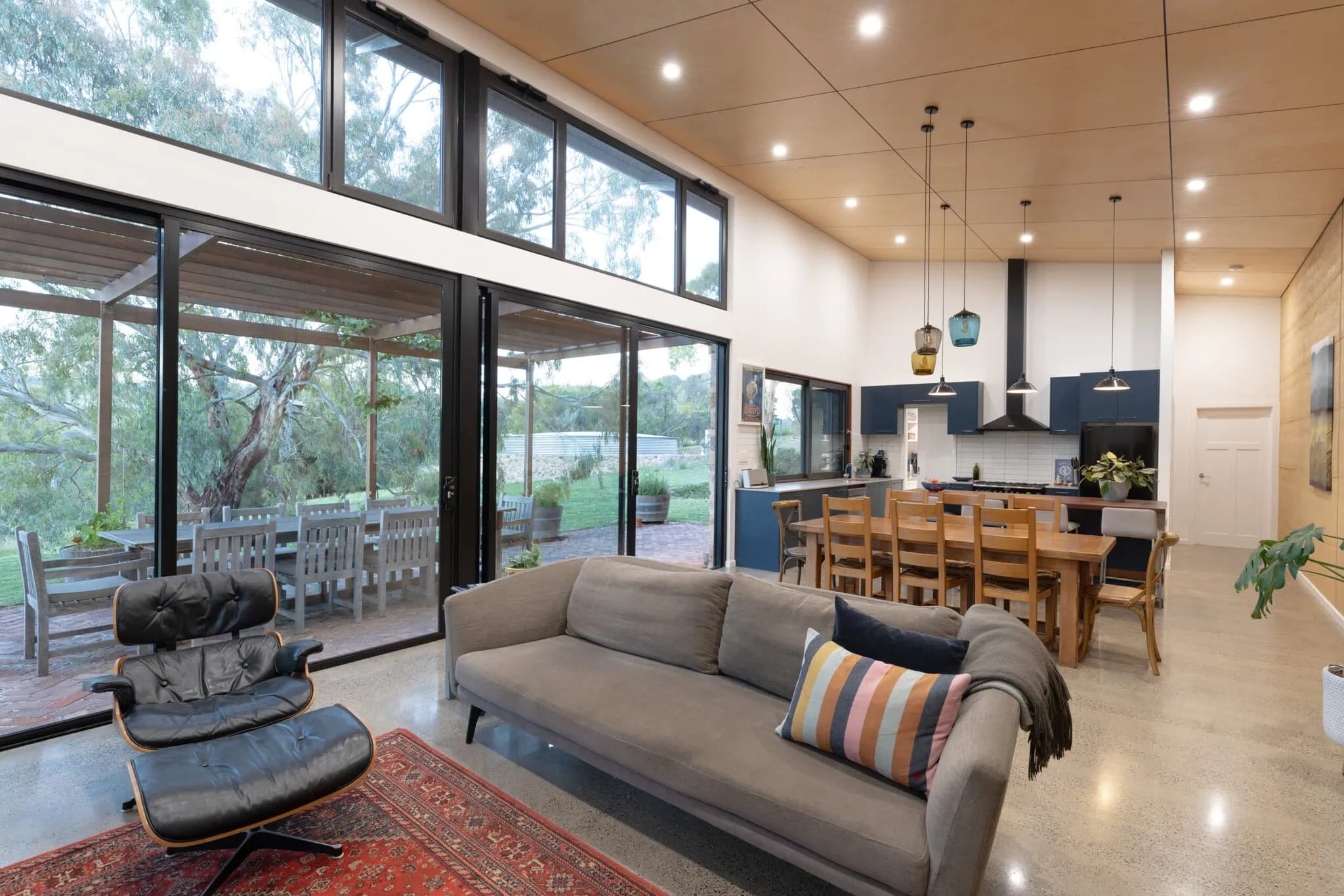 Bright, open-plan living space with large windows and contemporary design, perfect for Australian homes.