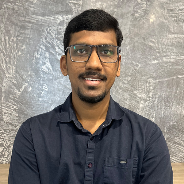 Portrait of a team member at Enduro Builders, smiling in a professional setting.