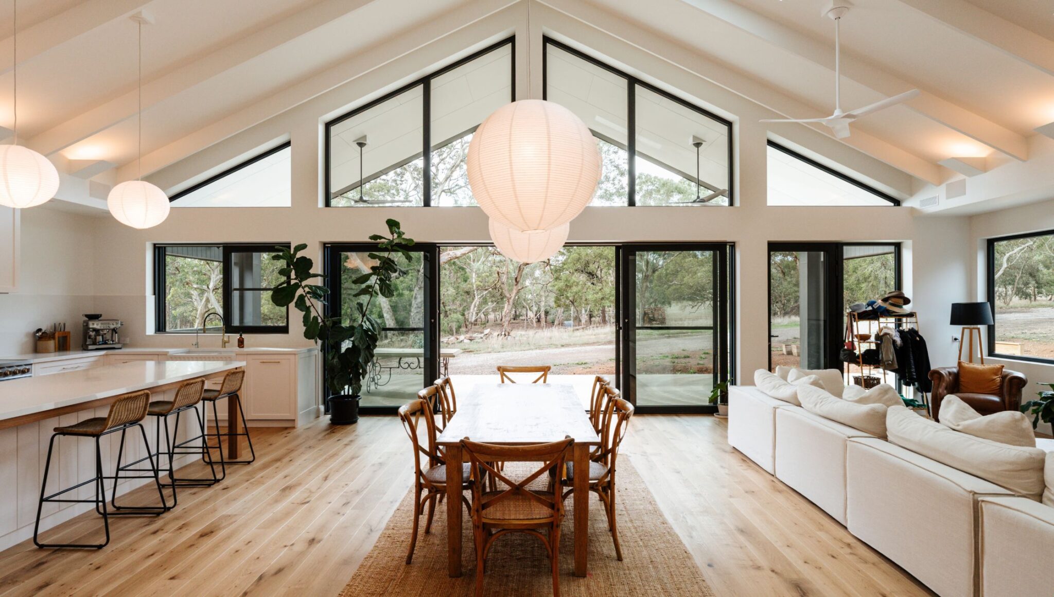 Spacious living room with expansive glass windows and natural light.
