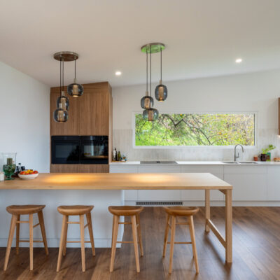 Contemporary kitchen with wooden accents and large window in Project Aberfoyle.
